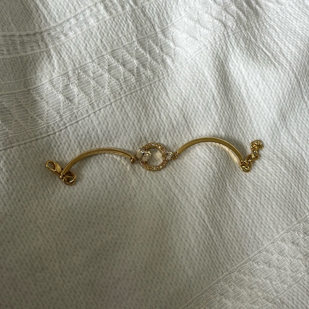 Gold Swarovski bracelet.